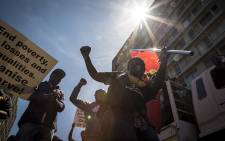 Members of Cosatu sing and dance in Cape Town's CBD during a march to Parliament where they handed over a list of demands to government. Picture: Thomas Holder/EWN