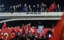 FILE: Turkish president Recep Tayyip Erdogan (C) delivers a speech to supporters in Istanbul. Picture: AFP.