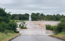 Storm water covers the low bridge outside Skukuza, over the Sabie River. Picture: SANParks.