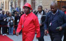 EFF leader Julius Malema wearing the party's signature red overalls. Picture: EWN.