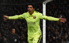 Barcelonas Uruguayan forward Luis Suarez celebrates scoring his and his teams second goal during the Uefa Champions League round of 16 first leg football match between Manchester City and Barcelona at the Etihad Stadium in Manchester, northwest England, on 24 February, 2015. Picture: AFP.