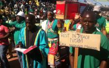 FILE: Amcu members walk around the Royal Bafokeng Stadium near Rustenburg with a coffin reading ‘rest in peace NUM and Cosatu’ at the union's mass meeting on 23 June 2014. Picture: Reinart Toerien/EWN.