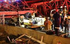 FILE: The scaffolding of a pedestrian bridge under construction in Sandton collapsed on the M1 highway on Wednesday, killing 2 people and injuring at least 23 others. Picture: Christa Eybers/EWN.