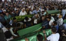 People gather for the funeral of victims of last night's attack on a wedding party that left 51 dead in Gaziantep in southeastern Turkey near the Syrian border on August 21, 2016. Picture: AFP.