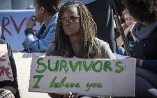 A UCT student holds up a poster during a protest against rape and sexual abuse on campus on 11 May 2016. Picture: Thomas Holder/EWN
