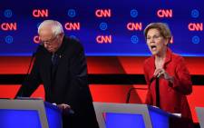 FILE: Democratic presidential hopeful US Senator from Massachusetts Elizabeth Warren (R) delivers her closing statement next to US senator from Vermont Bernie Sanders during the first round of the second Democratic primary debate of the 2020 presidential campaign season hosted by CNN at the Fox Theatre in Detroit, Michigan on 30 July 2019. Picture: AFP.