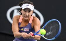 This file photo taken on 21 January 2020 shows China's Peng Shuai hitting a return against Japan's Nao Hibino during their women's singles match on day two of the Australian Open tennis tournament in Melbourne. Picture: Greg Wood/AFP