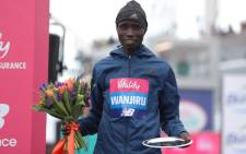 FILE: Second placed Kenya's Daniel Wanjiru poses with his trophy after the half marathon elite men's race during the inaugural The Big Half in London on 4 March 2018. Picture: AFP
