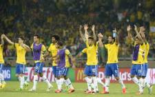 Brazil celebrates after defeating Uruguay in the Confederations Cup semi-final in Belo Horizonte, June 26 2013. Picture: AFP.