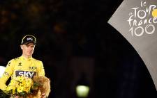 Tour de France 2013 winner Britain's Chris Froome poses at the end of the 133.5 km 21st and last stage of the 100th edition of the Tour de France cycling race on 21 July 2013. Picture: AFP"