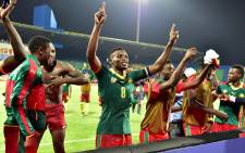 Cameroon’s players celebrate at the end of the 2017 Africa Cup of Nations semi-final football match between Cameroon and Ghana in Franceville on 2 February, 2017. Picture: AFP.