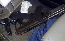 An R5 rifle, Z88 pistol, police radio and a police bulletproof vest were found in the fake police car after the shooting on 3 September 2014. Picture: Supplied to EWN.