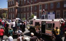 Fees 2017 protesters climb on top of the police Nyala on their way to Parliament. Picture: Anthony Molyneaux/EWN.