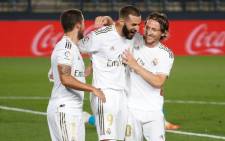 FILE: Real Madrid's Karim Benzema (centre) celebrates a goal with his teammates. Picture: @realmadriden/Twitter