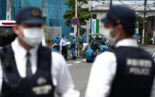 Police forensic experts (C) are seen at the crime scene where a man stabbed 19 people, including children in Kawasaki on 28 May 2019. Picture: AFP