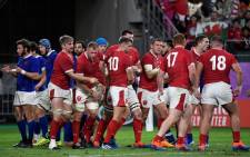 Wales' players react after back row Ross Moriarty scored a try during the Japan 2019 Rugby World Cup quarter-final match between Wales and France at the Oita Stadium in Oita on 20 October 2019. Picture: AFP