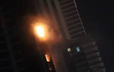 Fire is seen at the 1,105 foot tall Torch tower skyscraper on August 4, 2017 in Dubai. Picture: AFP