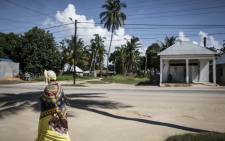 FILE: In this file photo, a Mozambican woman walks in Palma, a small, palm-fringed fishing town meant to become a symbol of Mozambique's glittering future, transformed by one of the world's largest liquefied natural gas projects. Islamist militants have seized control of the northern Mozambique town of Palma, near a huge gas project involving French oil major Total and other international energy companies, security sources said on 27 March 2021. Picture: AFP