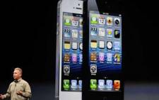 Apple Inc senior Vice President Phil Schiller reveals the new iPhone 5 on 12 September, 2012. Picture: Reuters.