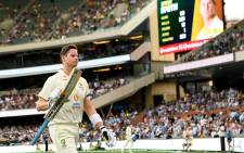 Australia's batsman Steve Smith acknowledges the crowd's applause as he walks off the field after his dismissal on day two of the second cricket Test match of the Ashes series at Adelaide Oval on 17 December 2021, in Adelaide. Picture: William WEST/AFP