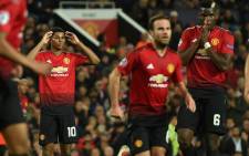 Manchester United's English striker Marcus Rashford and Manchester United's French midfielder Paul Pogba gesture during the Champions League group H football match between Manchester United and Juventus at Old Trafford in Manchester, north west England, on 23 October, 2018. Picture: AFP.