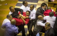 EFF MP Mbuyiseni Ndlozi is forcefully removed from the National Assembly along with other party members on 17 May 2016. Picture: Aletta Harrison/EWN.