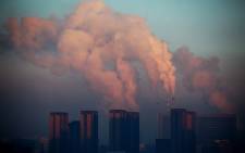 FILE: This picture shows a thermal power plant discharging heavy smog into the air in Changchun, northeast China's Jilin province. Picture: AFP