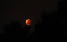FILE: Clear skies during the early hours on 28 September allowed South Africans to witness the rare lunar eclipse of a so-called 'blood moon' or 'supermoon'. Picture: Nishaan Desai.