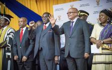 President Jacob Zuma and Zimbabwean President Robert Mugabe made their way through the University of Fort Hare sports complex and onto stage to the singing and cheering of the audience. Picture: Thomas Holder/EWN.