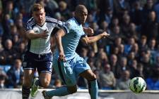West Bromwich Albion's English-born Scottish midfielder James Morrison (L) competes with Manchester City's Brazilian midfielder Fernando during the English Premier League football match between Manchester City and West Bromwich Albion at the Etihad Stadium in Manchester, north west England, on March 21, 2015. Picture: AFP