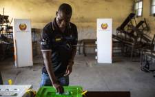 A man casts his vote at Amirca Cabral Primary School in Beira on 15 October 2019. Picture: AFP
