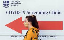 A woman queues outside a COVID-19 coronavirus testing venue at The Royal Melbourne Hospital in Melbourne on 16 July 2020. Picture: AFP