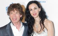 Mick Jagger and US stylist L’Wren Scott. Picture: AFP.
