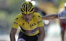 Switzerlands Fabian Cancellara, wearing the overall leaders yellow jersey, reacts after crossing the finish line at the end of the 159.5 km third stage of the 102nd edition of the Tour de France cycling race on 6 July, 2015, between the Belgian cities of Antwerp and Huy. Picture: AFP.