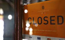 FILE: A business owner closes up shop due to a power outage. Picture: Sethembiso Zulu/EWN
