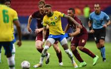 Brazil's Neymar (centre) holds off two Venezuelan players during their Copa America match on 13 June 2021. Picture: @CopaAmerica/Twitter