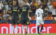 Juventus forward Cristiano Ronaldo (L) reacts next to teammate Federico Bernardeschi after receiving a red card during the UEFA Champions League group H football match between Valencia CF and Juventus FC at the Mestalla stadium in Valencia on 19 September, 2018. Picture: AFP