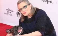 Gary the dog and Carrie Fisher. Picture: Getty Images for Tribeca Film Festival/AFP.
