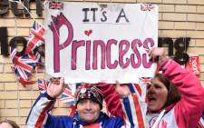 Royal fans celebrate outside the Lindo wing at St Mary’s hospital in central London, on 2 May 2015 after the news is passed that Catherine, Duchess of Cambridge and Prince William’s second child, a daughter, was born. Picture: AFP.
