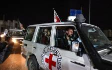 An International Red Cross vehicle carrying Israeli Russian hostage Ron Krivoy released by Hamas drives towards the Rafah border point with Egypt ahead of a transfer to Israel on 26 November 2023. Picture: Mohammed ABED/AFP
