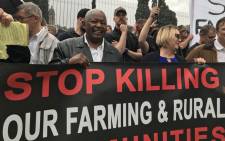 Cope leader Mosiuoa Lekota (C) pictured with demonstrators who marched to the Union Buildings against farm murders. Picture:  Christa Eybers / EWN