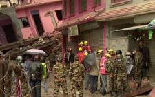FILE: Rescue efforts in Kathmandu, including mother of four who was trapped under rubble for 36 hours.