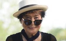 FILE: Yoko Ono smiles during a dedication ceremony for a giant tapestry, from Amnesty International, in honor of John Lennon on Ellis Island 29 July 2015 in New York. Picture: AFP