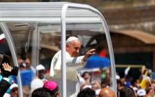 Pope Francis waves to the crowd as he arrives at Manger Square before presiding over an open-air mass on 25 May 2014. Picture: AFP.