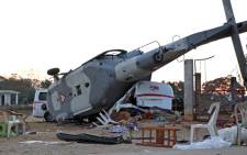 View of the remains of the military helicopter that fell on a van in Santiago Jamiltepec, Oaxaca state, Mexico, on 17 February 2018. Picture: AFP.