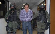 FILE: A handout picture shows Hector Beltran Leyva, leader of the Beltran Leyva's drug cartel, during a press conference at the headquarters of the General Attorney in Mexico City, on 1 October, 2014 after Beltran Leyva, aka the "H", was arrested in San Miguel de Allende, Guanajuato State, Mexico. Picture: AFP