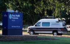 FILE: A medical transport van moves past Texas Health Presbyterian Hospital Dallas where a patient has been diagnosed with the Ebola virus on 30 September, 2014 in Dallas, Texas. Picture: AFP. 