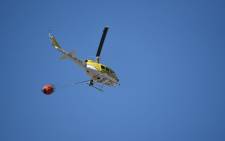 FILE: A helicopter works to put out a fire at Signal Hill. Picture: Working on Fire.