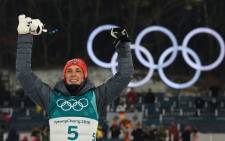 Gold medallist Germany's Eric Frenzel reacts on the podium following the Nordic combined men's individual normal hill NH/10km final at the Alpensia cross-country centre during the Pyeongchang 2018 Winter Olympic Games on 14 February 2018 in Pyeongchang. Picture: AFP