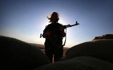 FILE: An Kurdish female member of the Freedom Party of Kurdistan keeps a position in Dibis, some 50 km northwest of Kirkuk, on September 15, 2014. Picture: AFP.